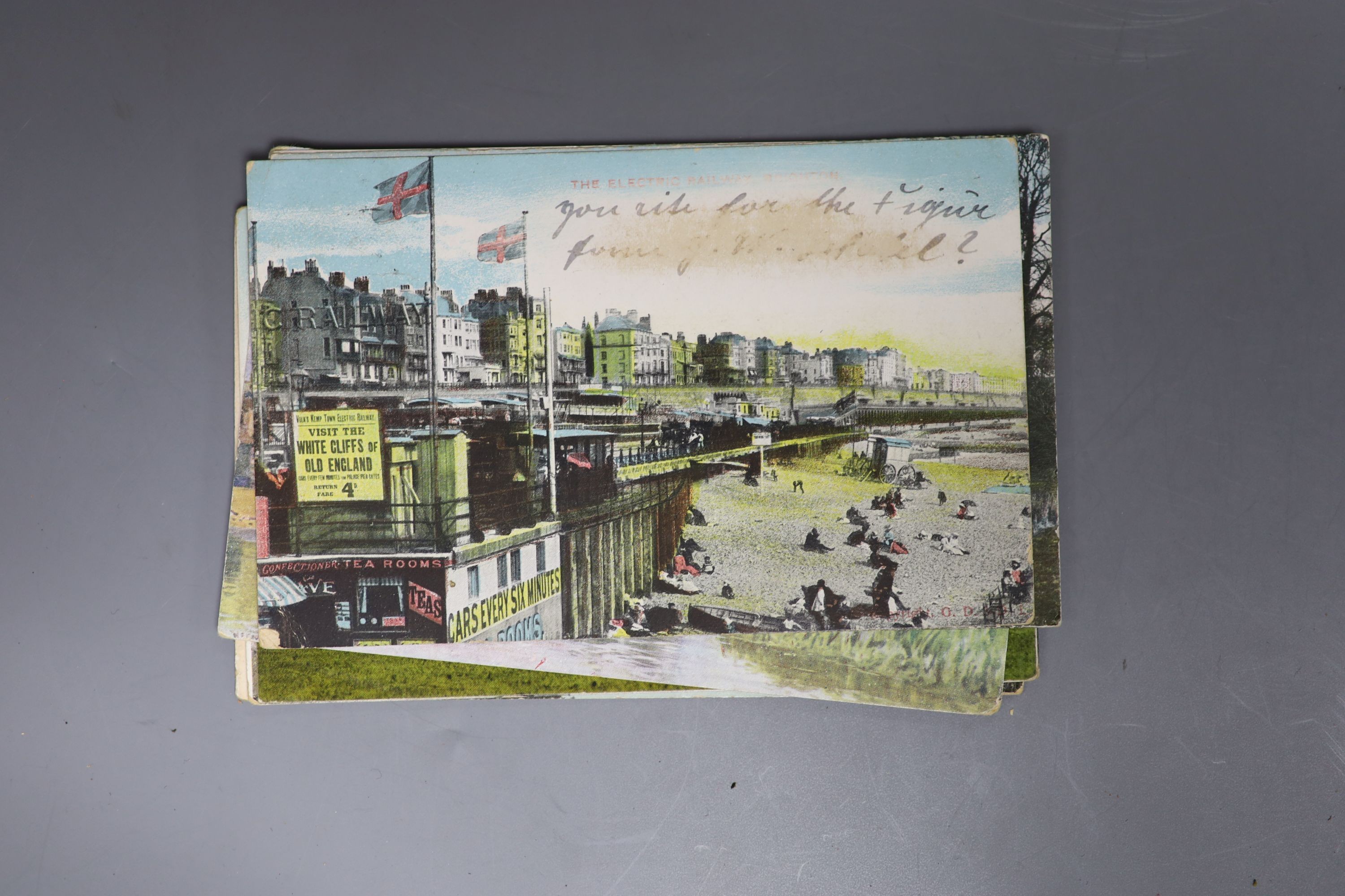 An album of Edwardian and later postcards, including Brighton and Sussex views